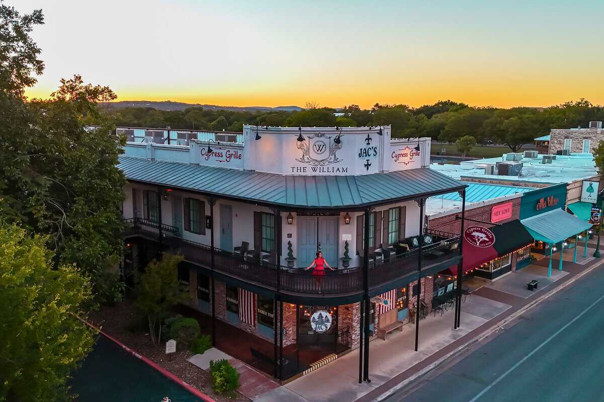 Twilight over a two-story corner building 