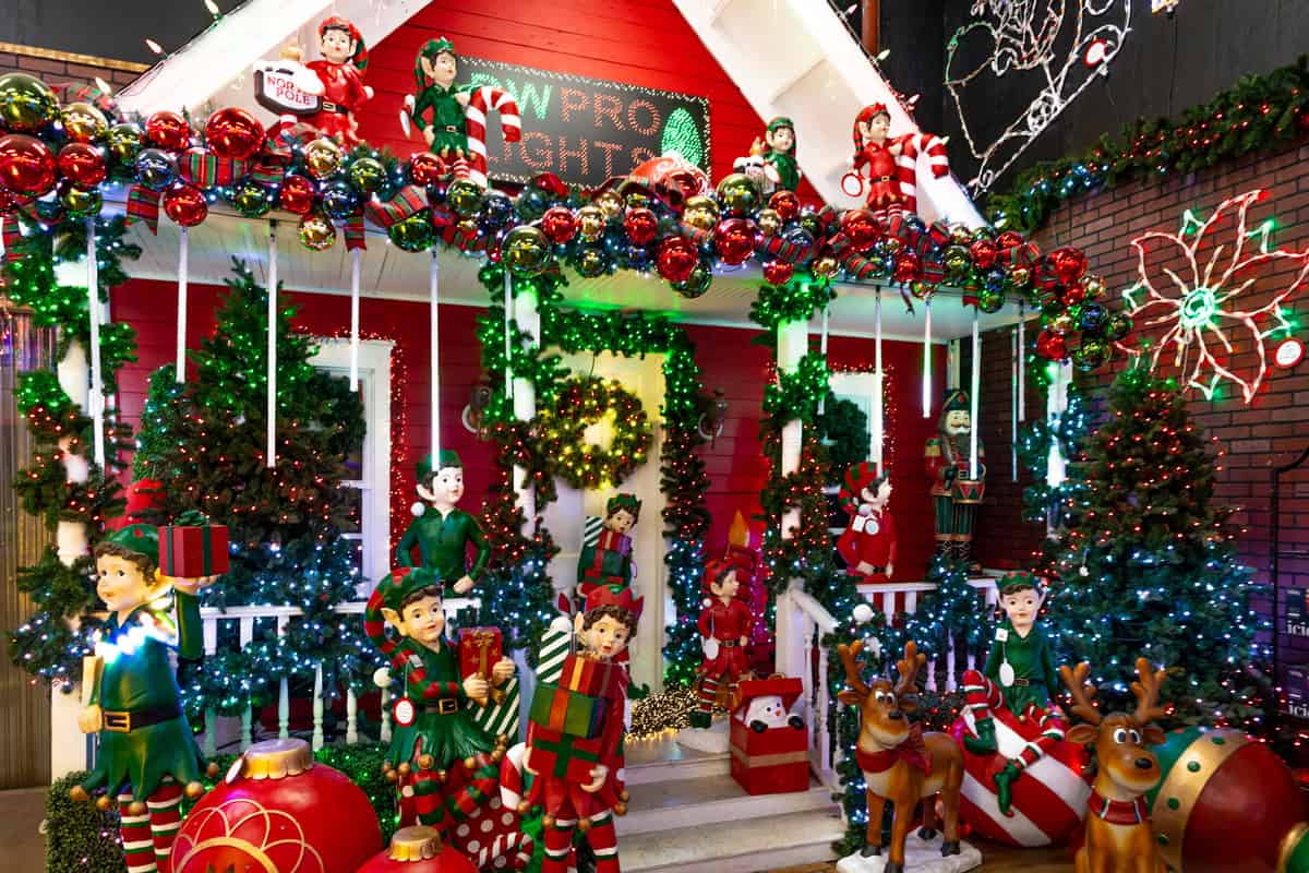 house adorned with colorful Christmas decorations, twinkling lights, and festive ornaments