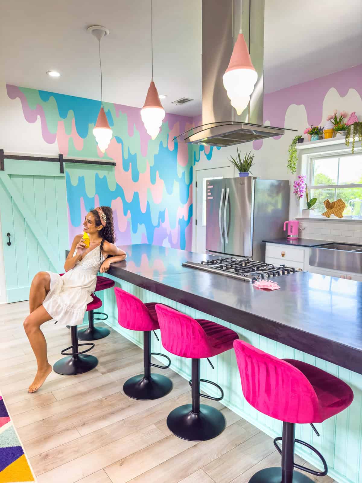 A colorful kitchen interior with ice cream cone pendant lights