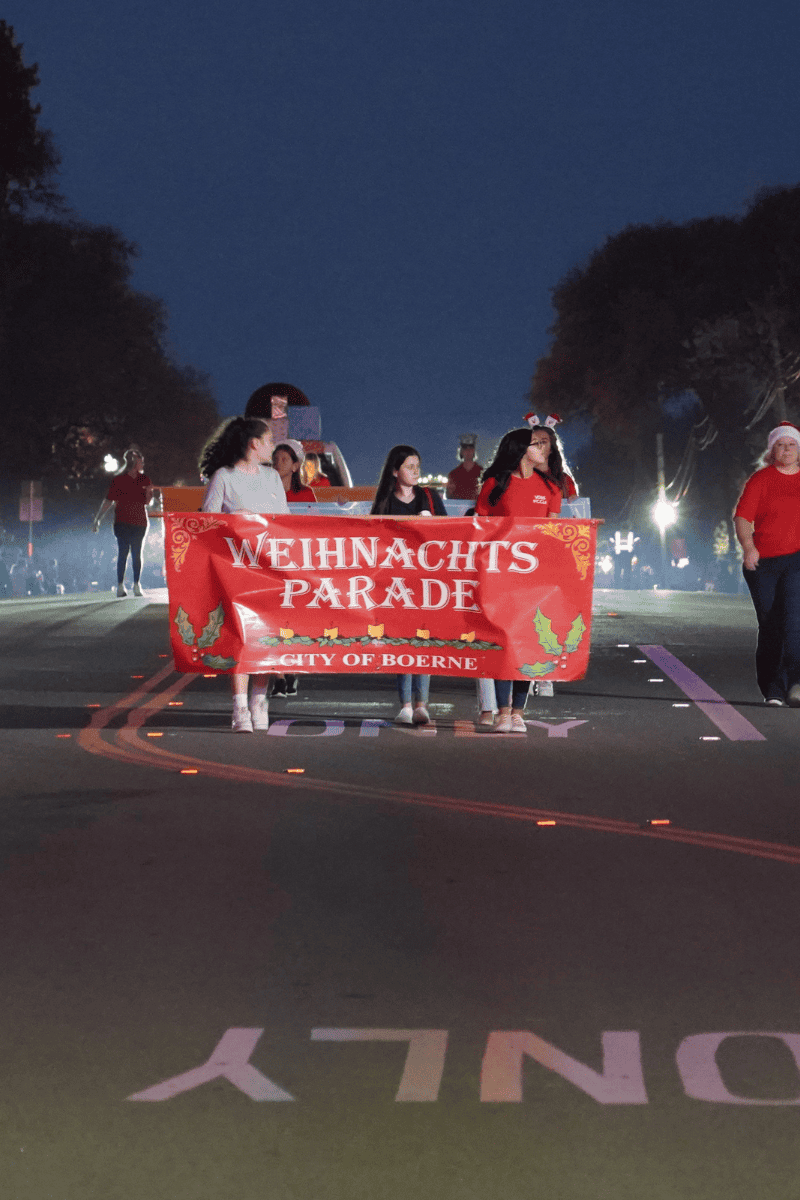 A crowd of people gathered on a parade.