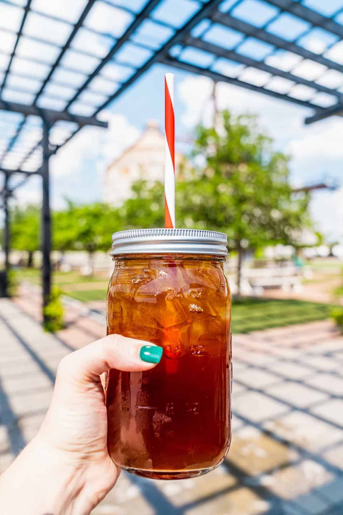 Mason Jar with Drink and Striped Straws that we got at Magnolia market in Waco Texas