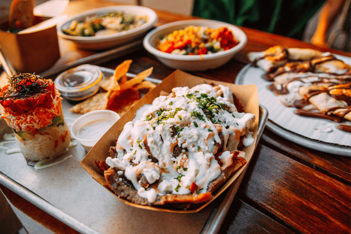 A vibrant spread of food including loaded nachos