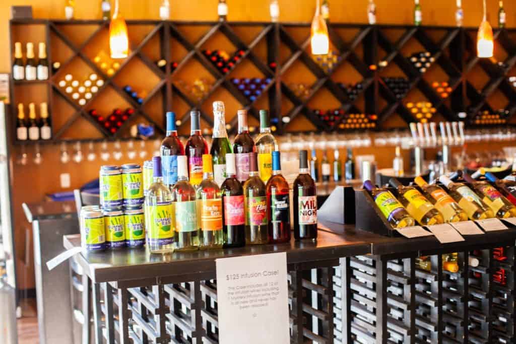 A stylish bar showcasing a variety of wine and flavored beverages