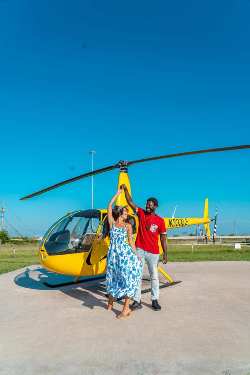 Ismail and I posing in front of a helicopter