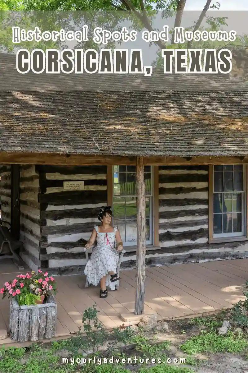 historical spot in corsicana texas - jessica serna sitting on one of the cabins at the pioneer village