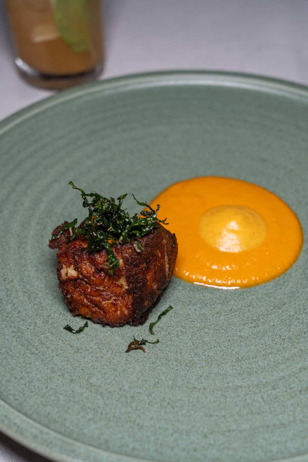 Plated savory course during dinner at Codex at Conrad Punta de Mita.