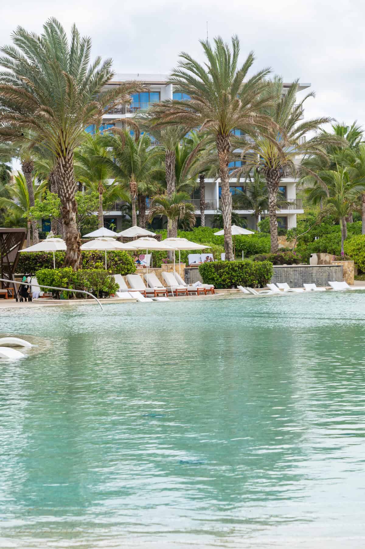Shaded pool loungers at Conrad Punta de Mita.