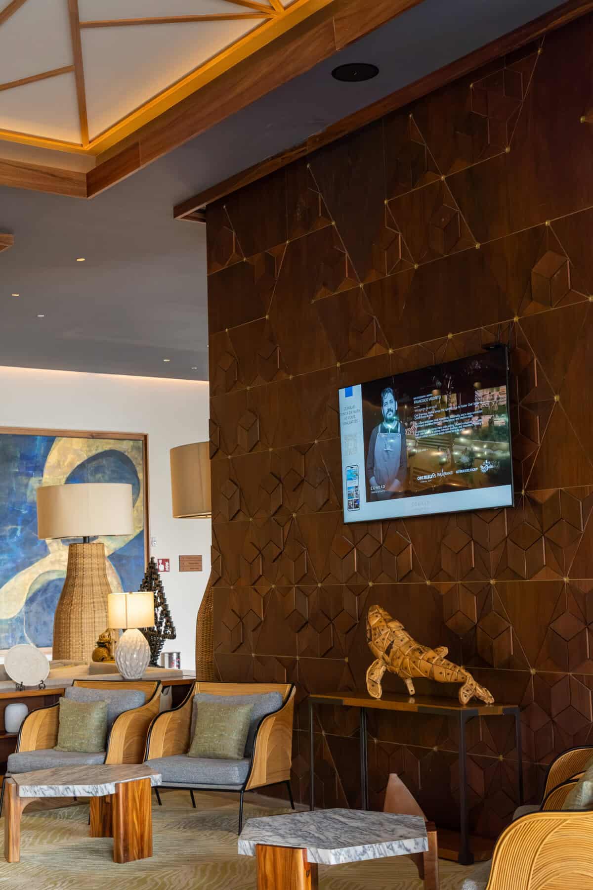 Lobby seating and carved wood wall details at Conrad Punta de Mita.