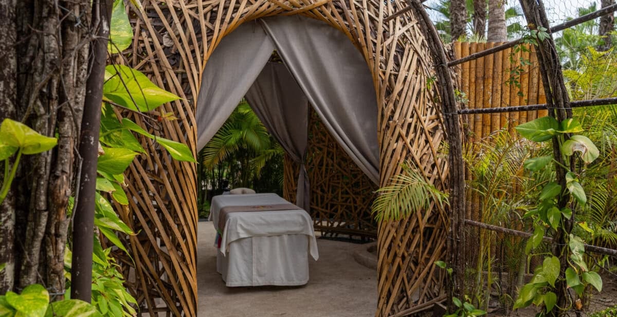 Outdoor spa massage nest surrounded by tropical greenery at Conrad Punta de Mita.