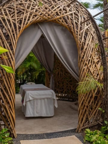 Outdoor spa massage nest surrounded by tropical greenery at Conrad Punta de Mita.