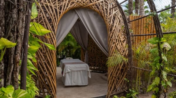 Outdoor spa massage nest surrounded by tropical greenery at Conrad Punta de Mita.