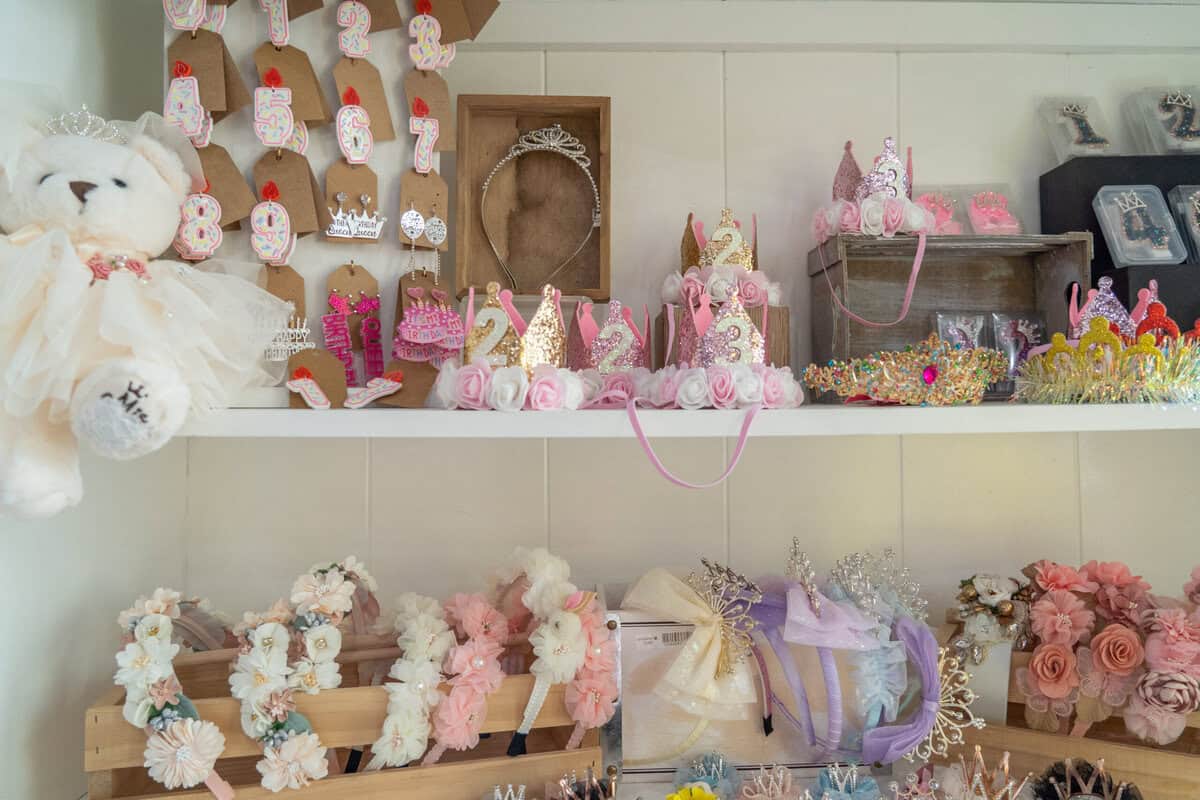 Shelves of handmade gifts and decor inside Craft Chicks in Tomball