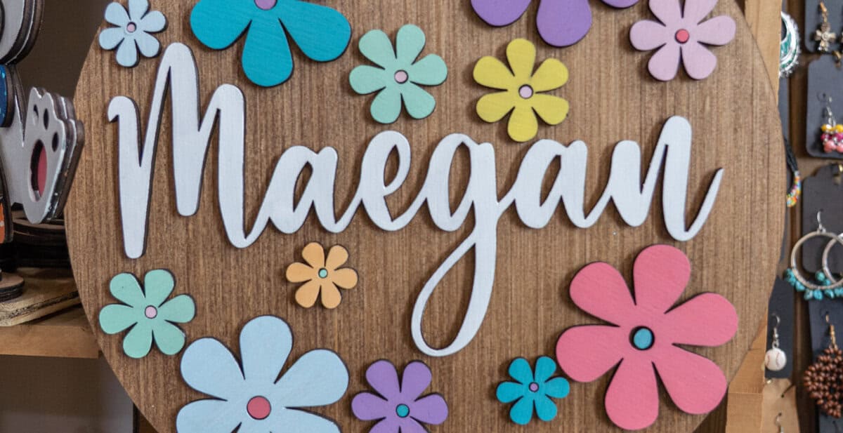 A personalized floral sign displayed at Craft Chicks in Tomball