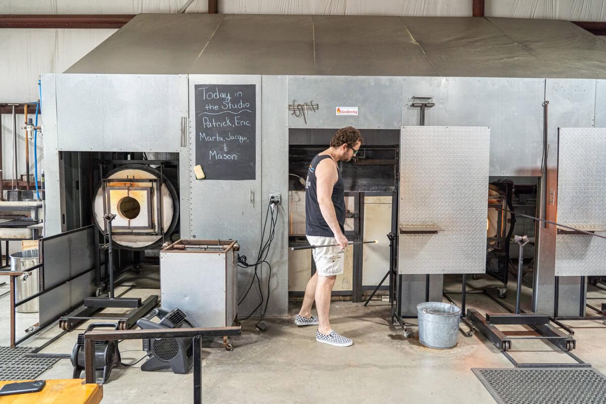 A live glassblowing demo in progress at Houston Glassblowing in Tomball