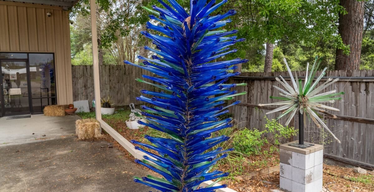 A blue glass sculpture outside Houston Glassblowing in Tomball