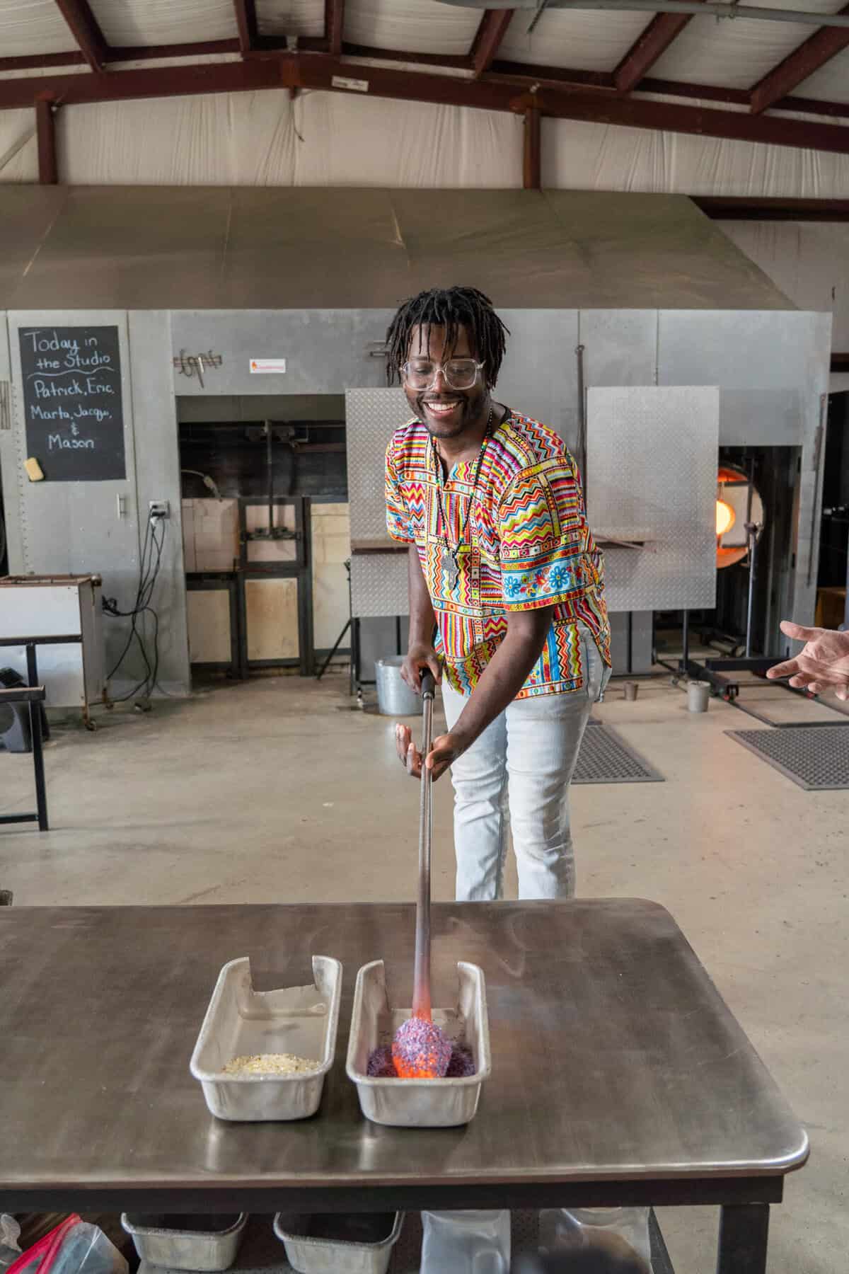 An instructor demonstrating glassblowing at Houston Glassblowing in Tomball