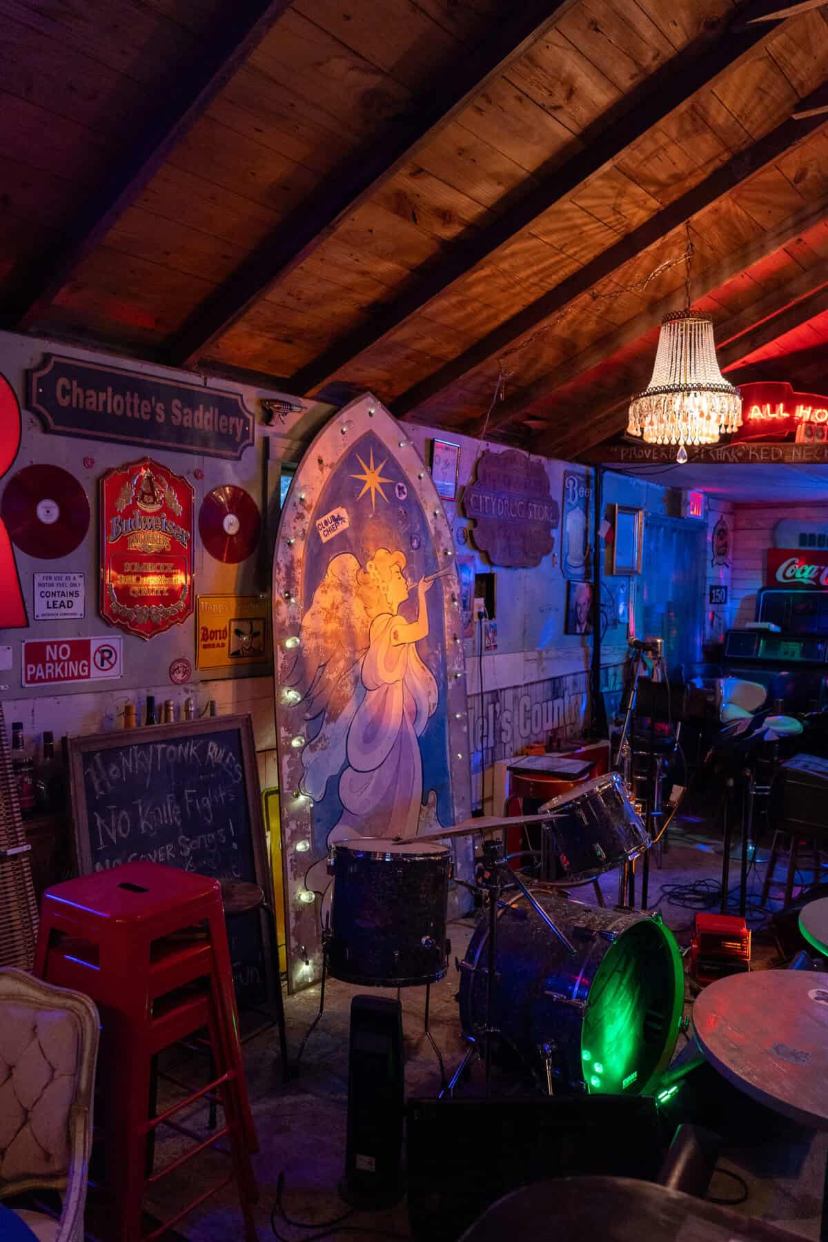 Angel mural and corner stage inside Old Tomball Honky Tonk