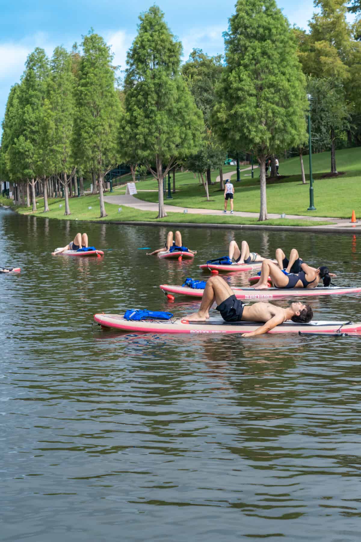 Stand-up paddleboard yoga class on the Waterway in The Woodlands
