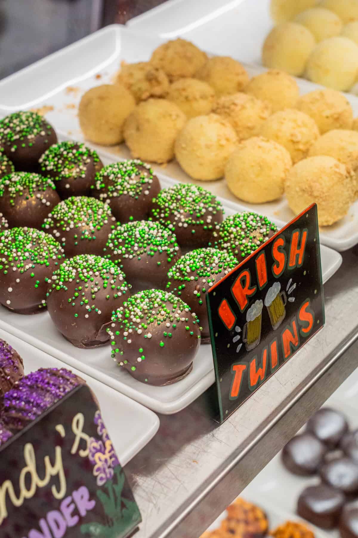 Chocolate truffles displayed inside the Tejas Chocolate and Barbecue case