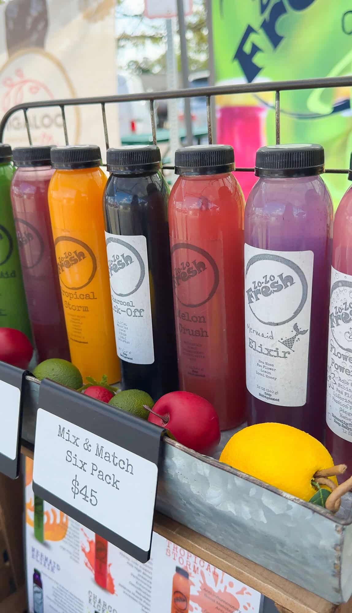 Colorful bottled juices are displayed at the Tomball Farmers Market.