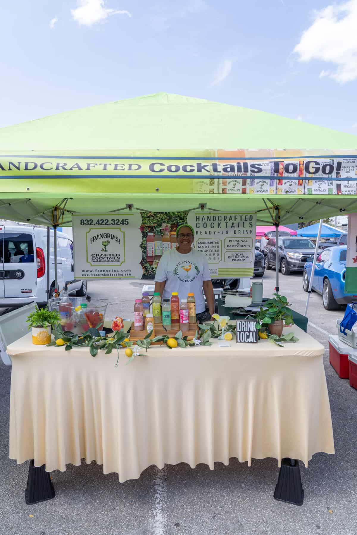 A colorful bottled cocktail booth is set up at the Tomball Farmers Market.