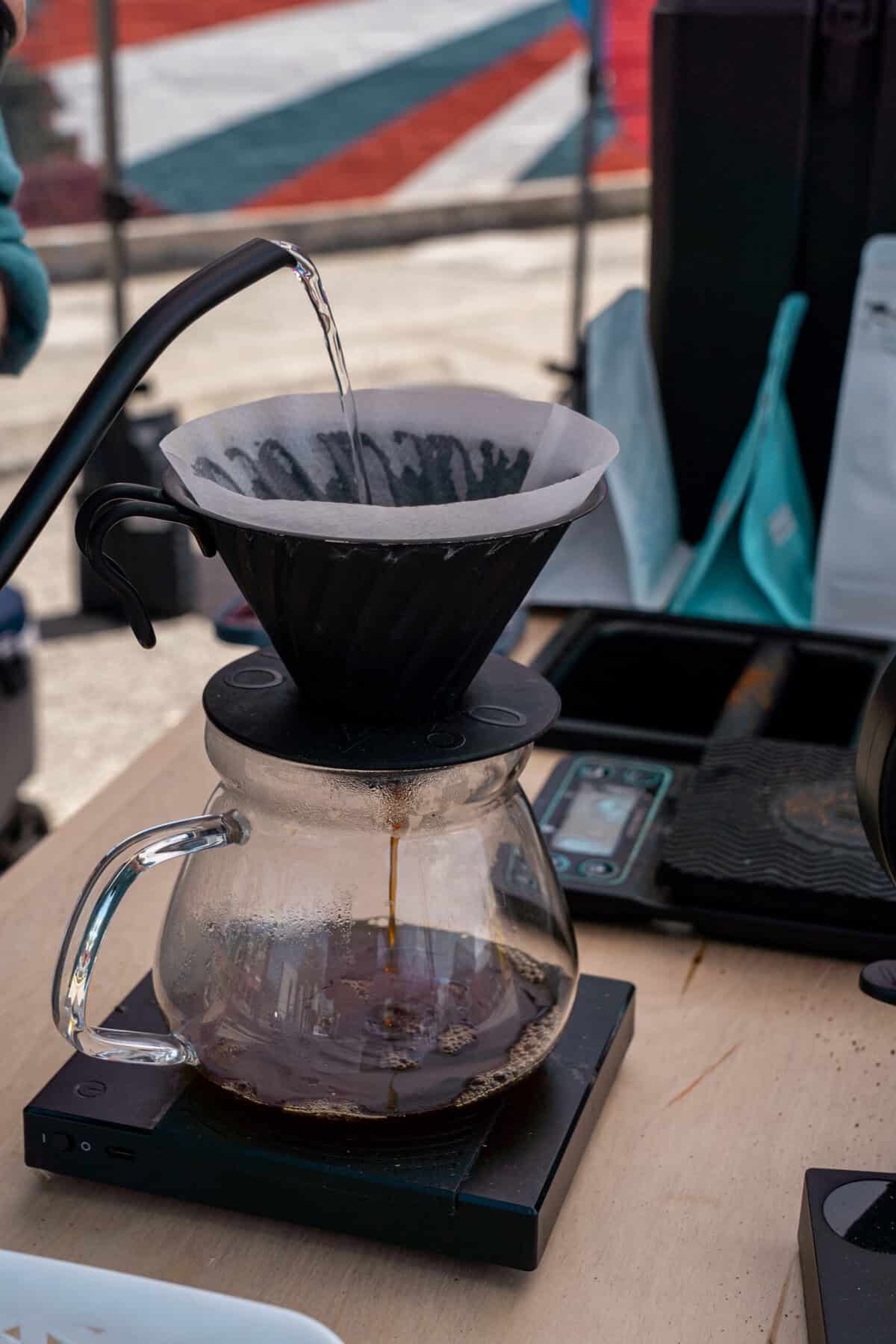 A pour-over coffee setup is displayed at the Tomball Farmers Market.