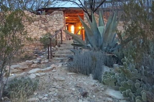 Stone exterior of Casa Mariposa restored rock ruin in Terlingua Ghost Town