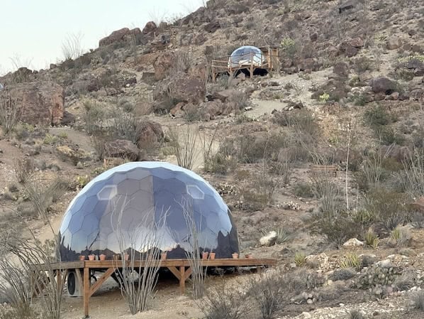 Geodesic dome stay near Big Bend set on a wooden platform in the desert