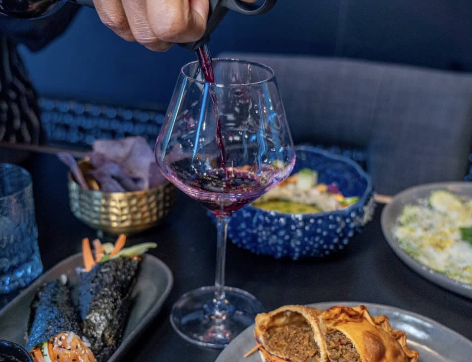 Red wine poured at Empty Glass wine bar in Tomball