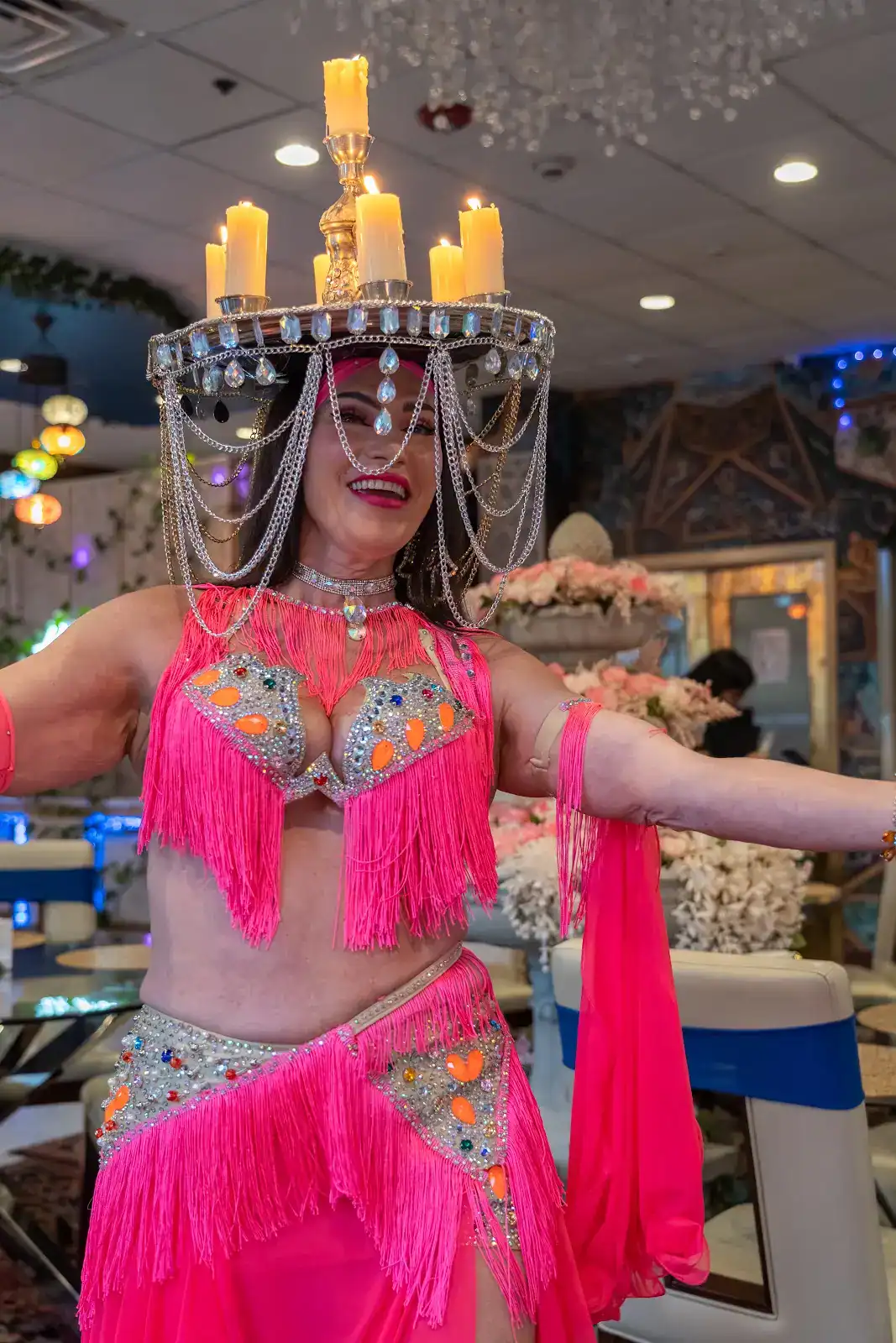 Belly dancer balancing a tray of lit candles at Lama Mediterranean Cuisine