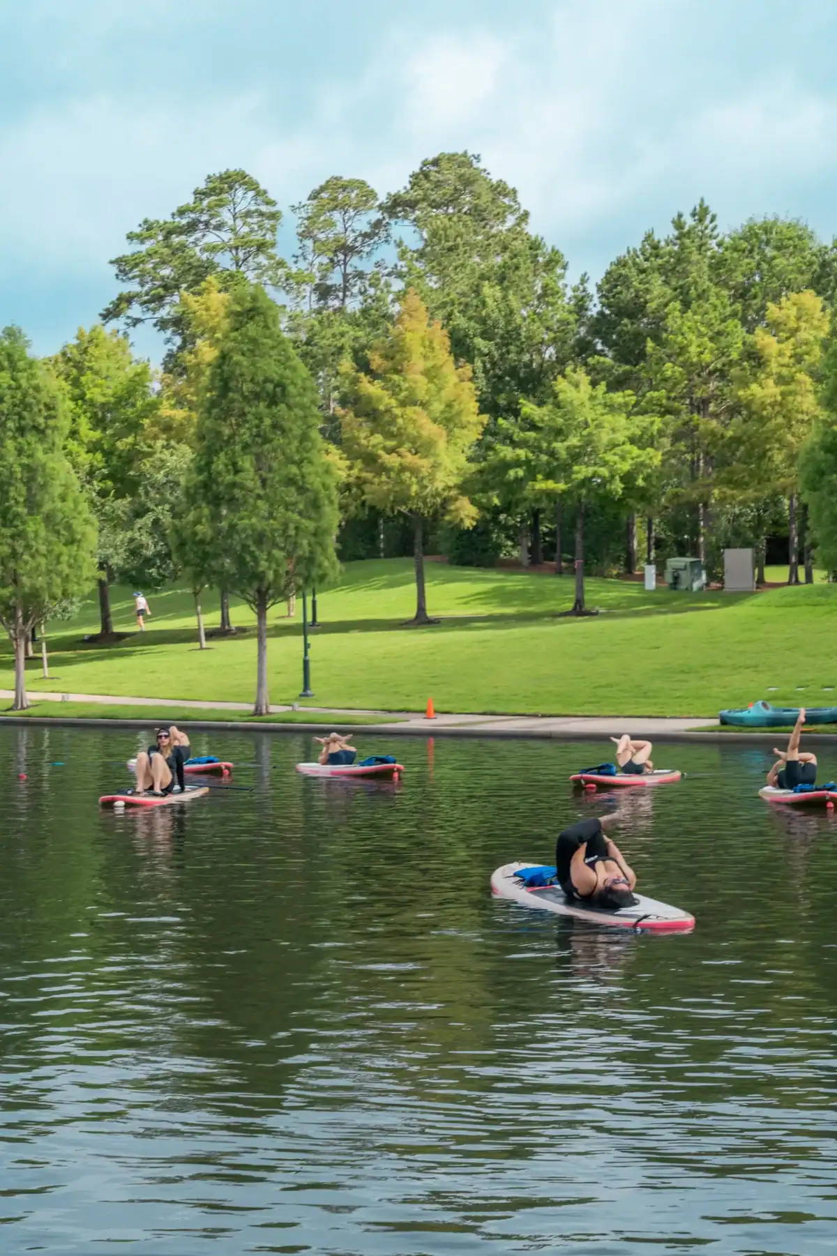 Paddleboard yoga class on the Waterway in The Woodlands