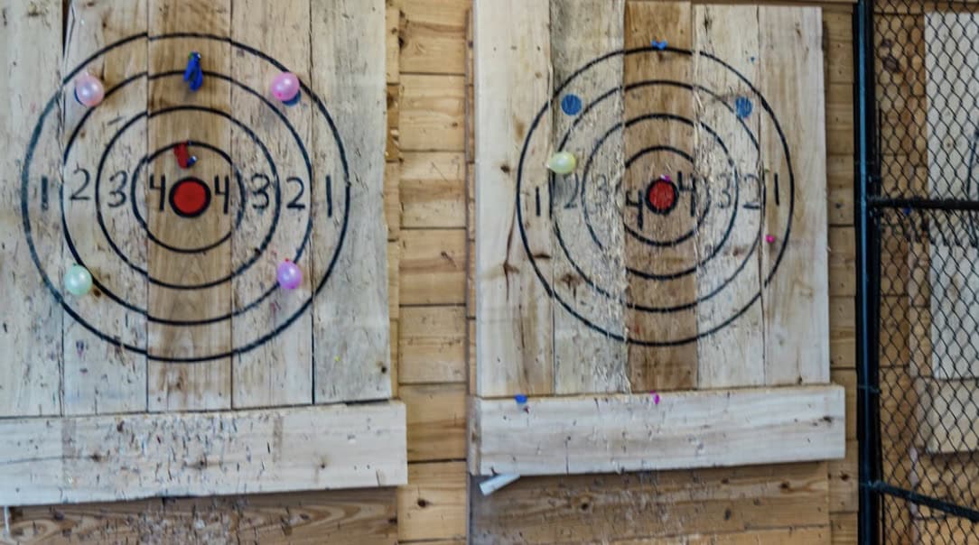 Wooden axe throwing targets at Slinging Axes in Tomball